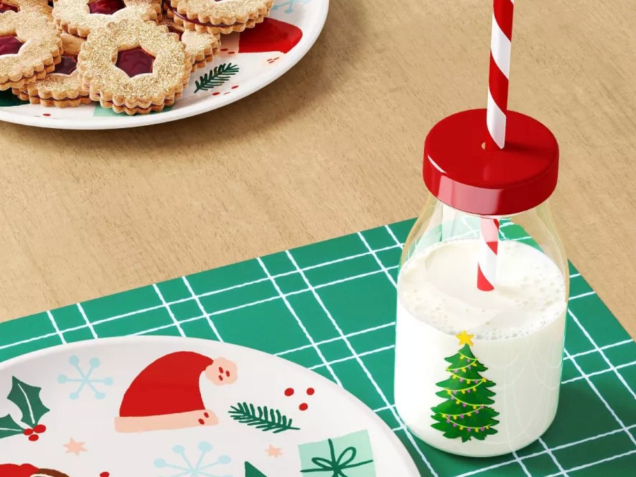 christmas tree tumbler filled with milk