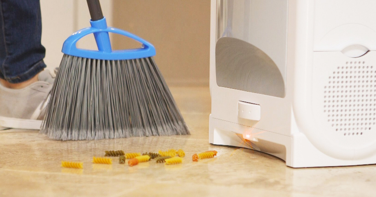 broom sweeping mess into Eyevac Pro