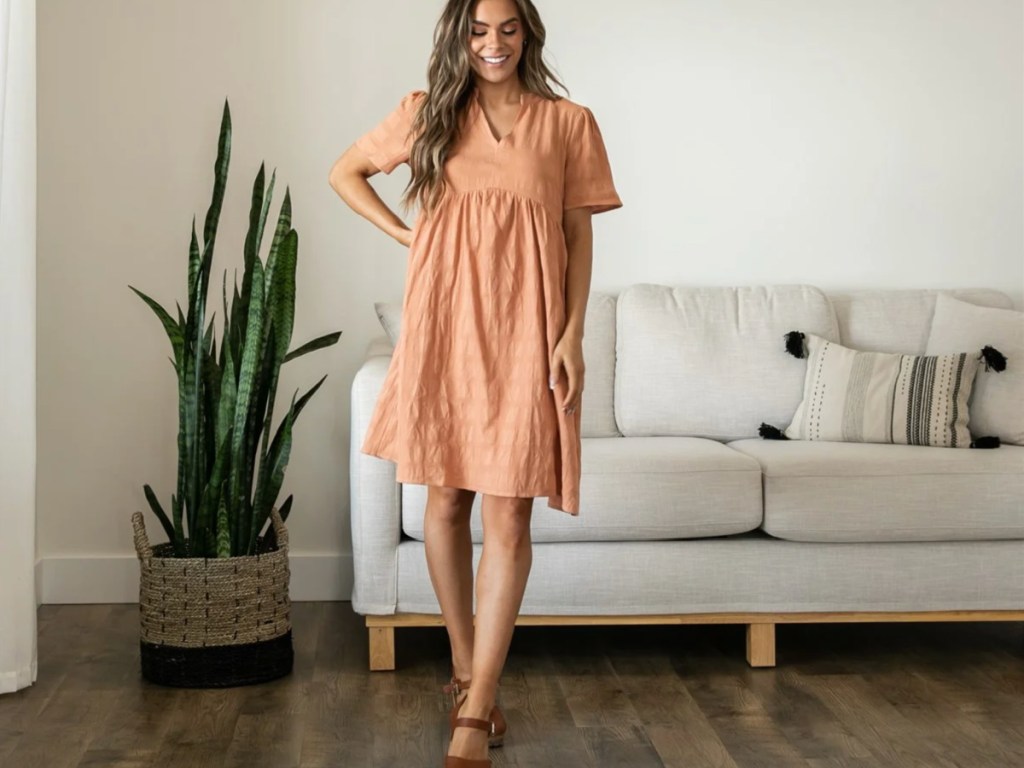 woman wearing light orange dress