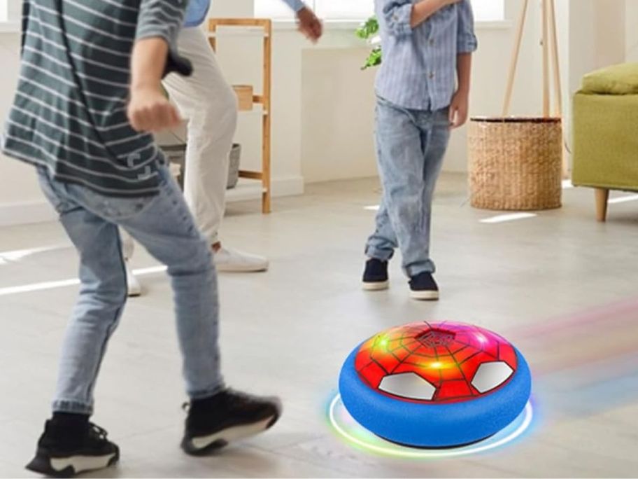 Kids playing with an LED Hover Soccer Spider Style