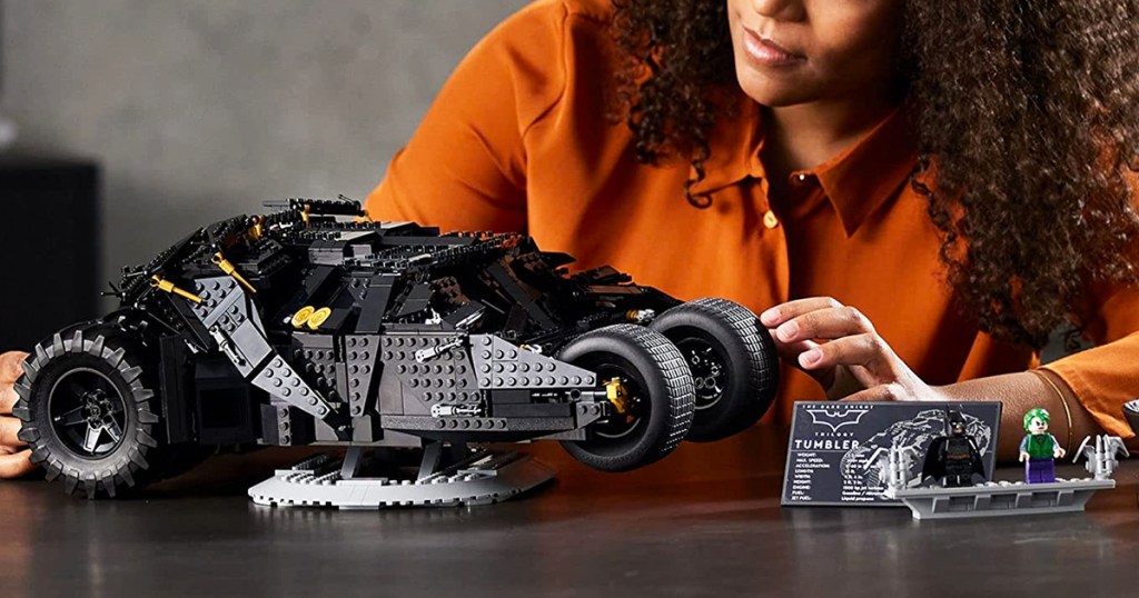 woman looking at LEGO DC Batman Batmobile Tumbler