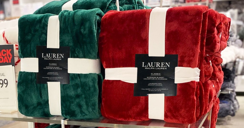 red and green plush blankets on store display