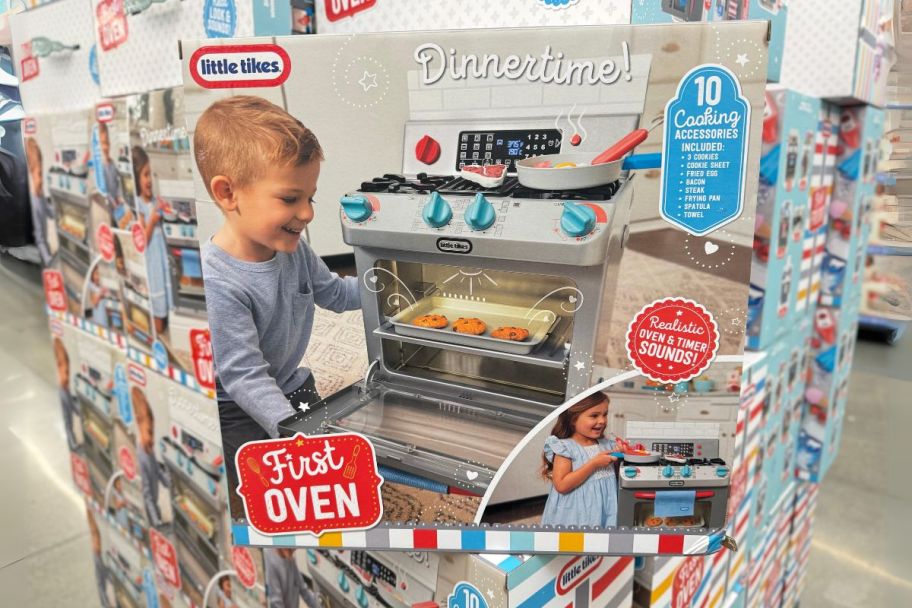 a box containing little tikes first oven sitting store shelf in a walmart store