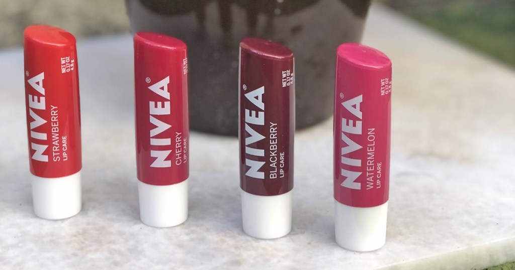 four nivea lip balms in a row