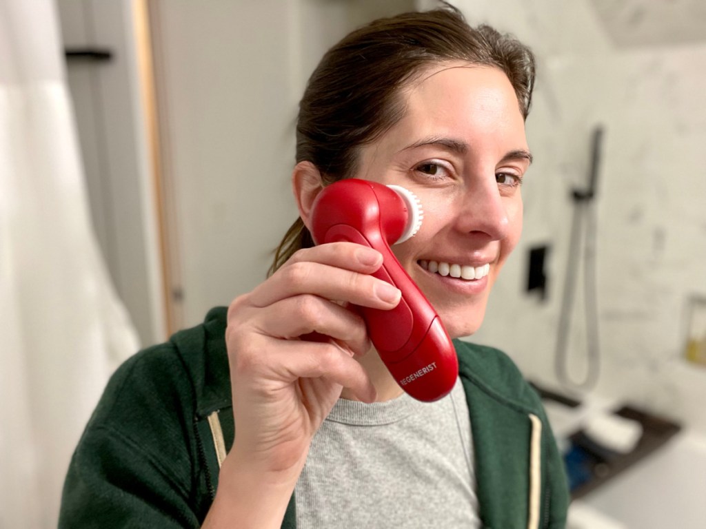 woman using Olay Regenerist Brush on her face