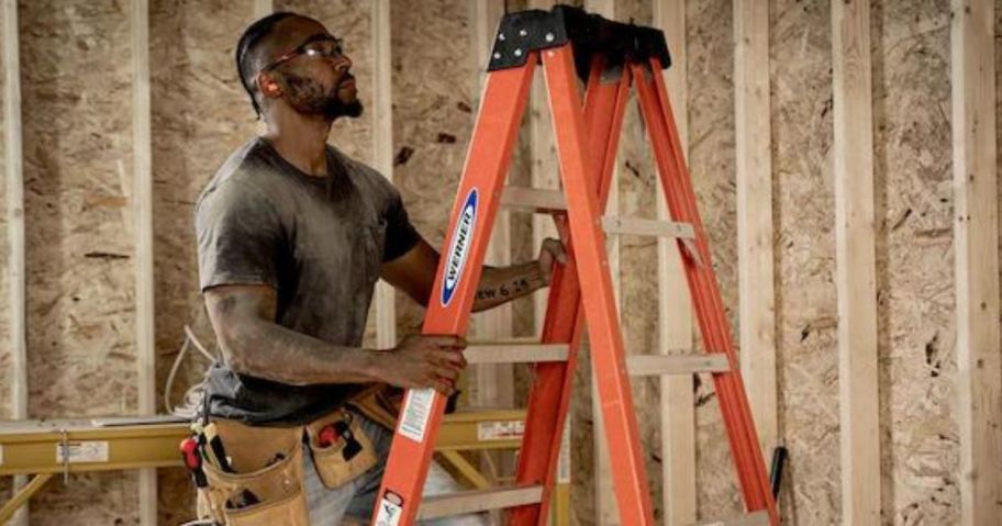 Man on a werner 6 foot fiberglass ladder