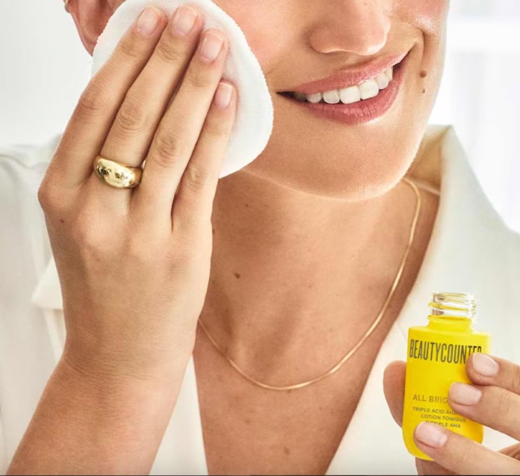 woman applying serum