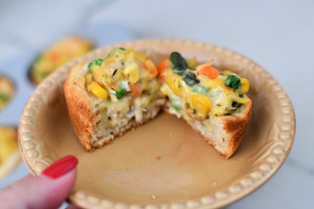 chicken pot pie cut in half on a plate