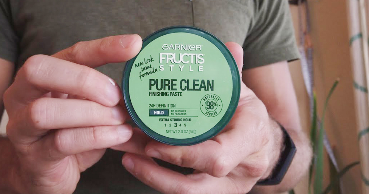 garnier fructis hair paste in mans hand