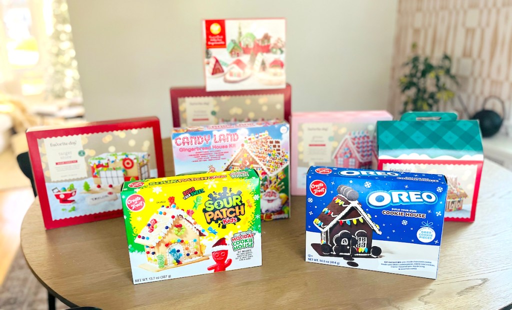 various boxes of gingerbread houses on table