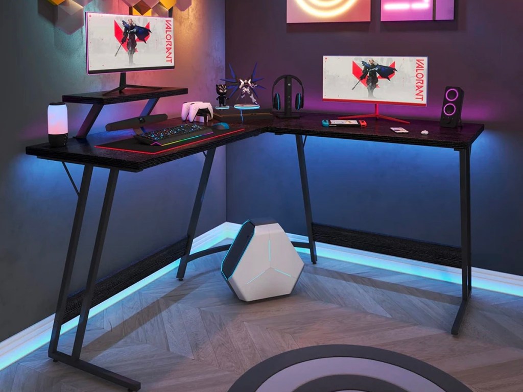 black l shaped gaming desk with onlineputer monitors 