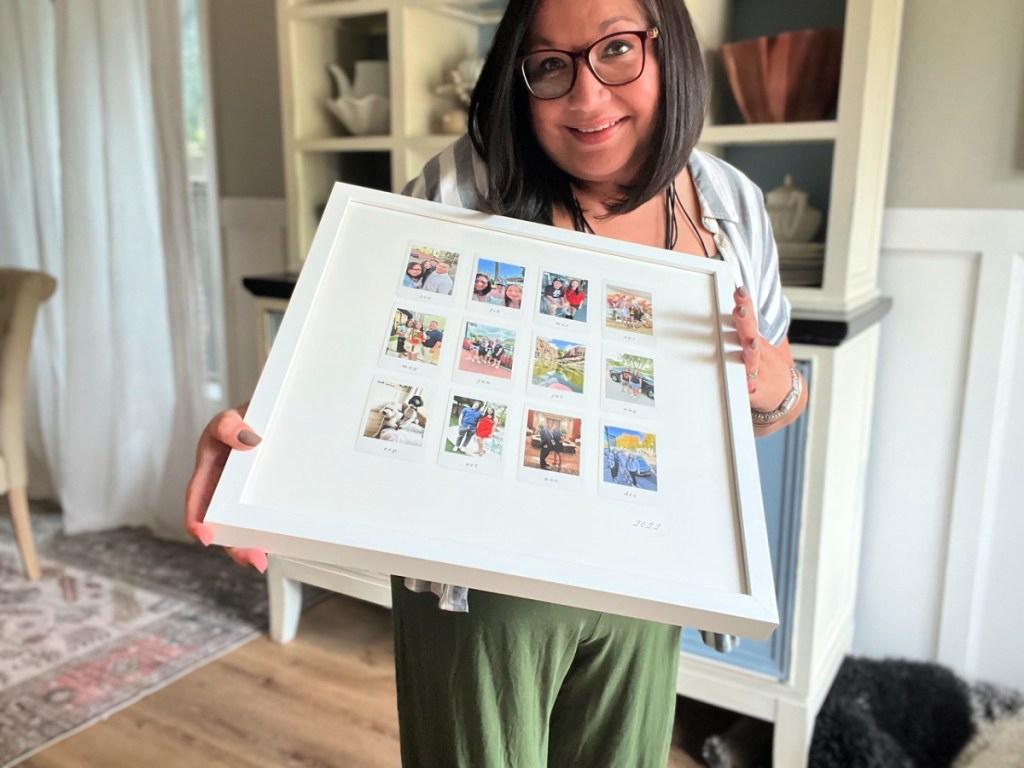 woman holding a minted perfect year framed print