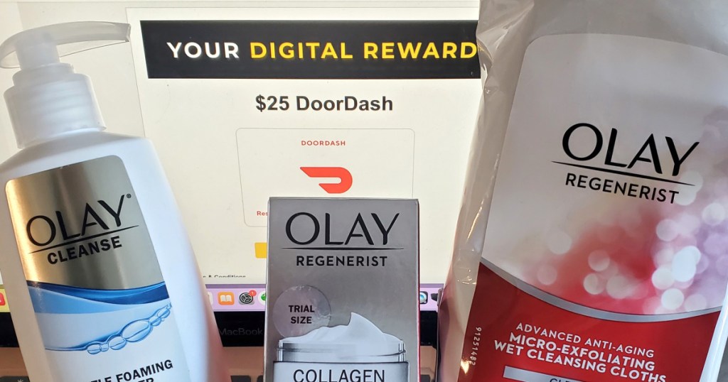 Olay products in front of onlineputer screen with digital reward displayed 