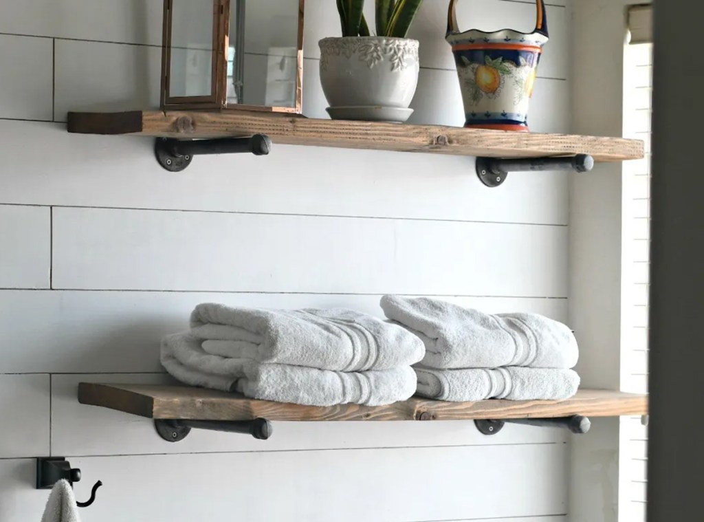 DIY pipe shelving on wall