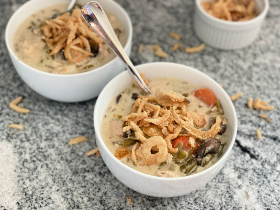 two bowls of green bean casserole soup