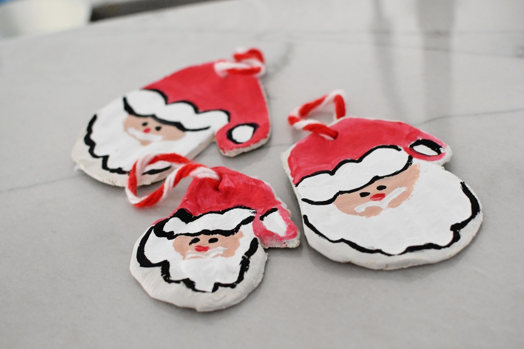 3 finished santa ornaments