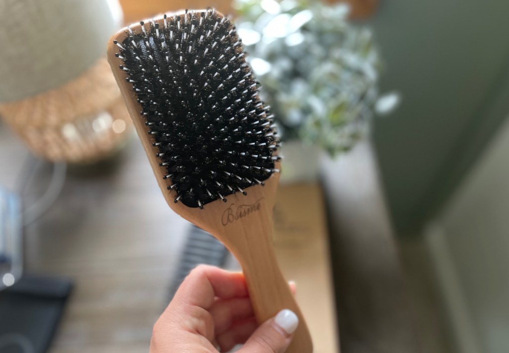 Boar Bristle Hair Brush in woman's hand