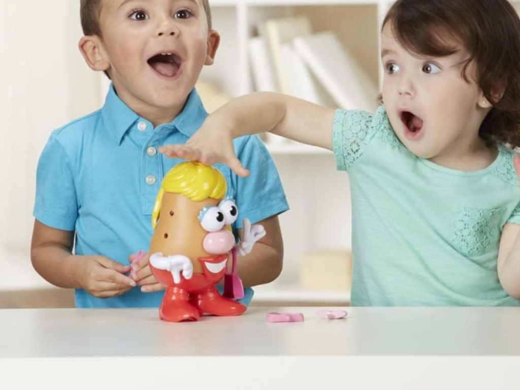 Children playing with Mrs. Potato Head