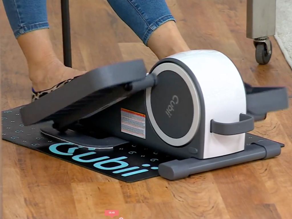 Woman using a Cubbii Groove elliptical