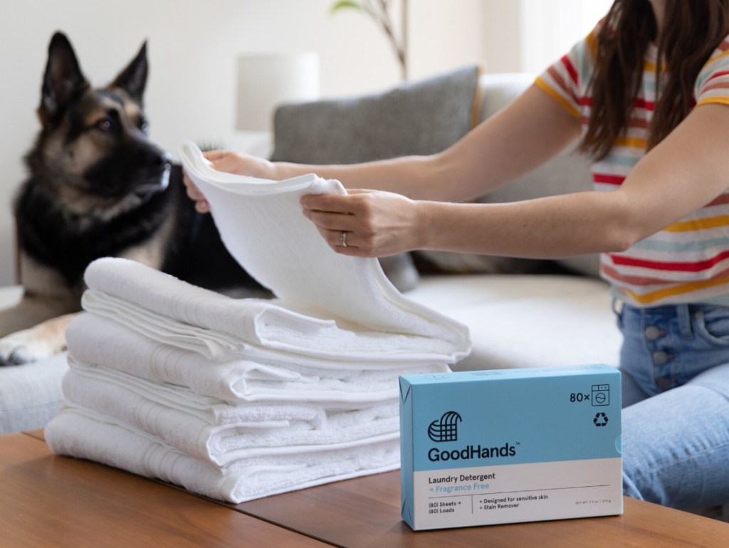 woman folding towels