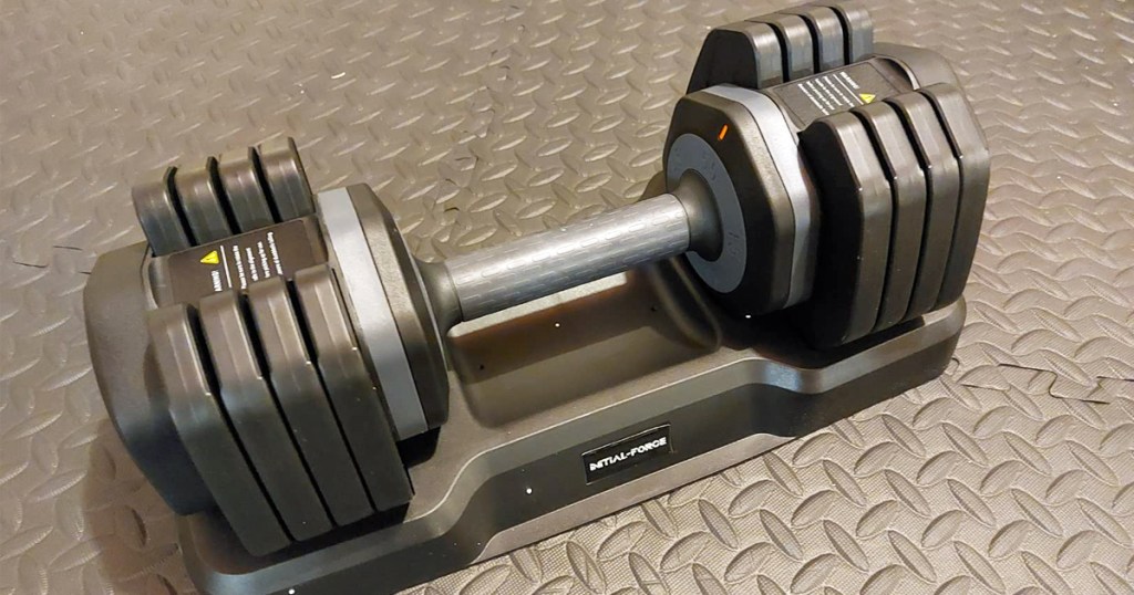 adjustable dumbbell set on floor