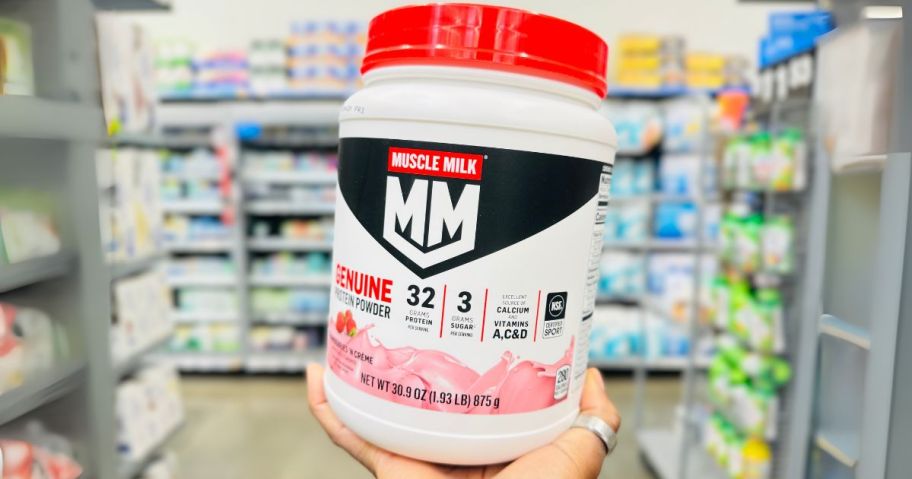 Muscle Milk Genuine Protein Powder 1.93-Pound in Strawberries 'N Creme in hand in store