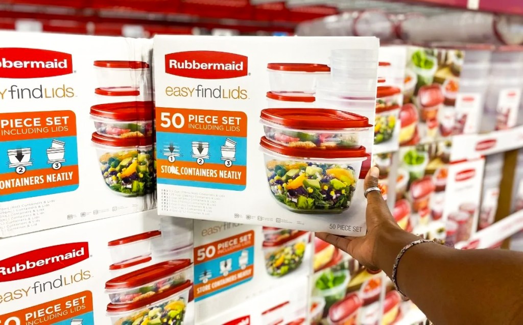 hand holding Rubbermaid 50-Piece EasyFindLids set