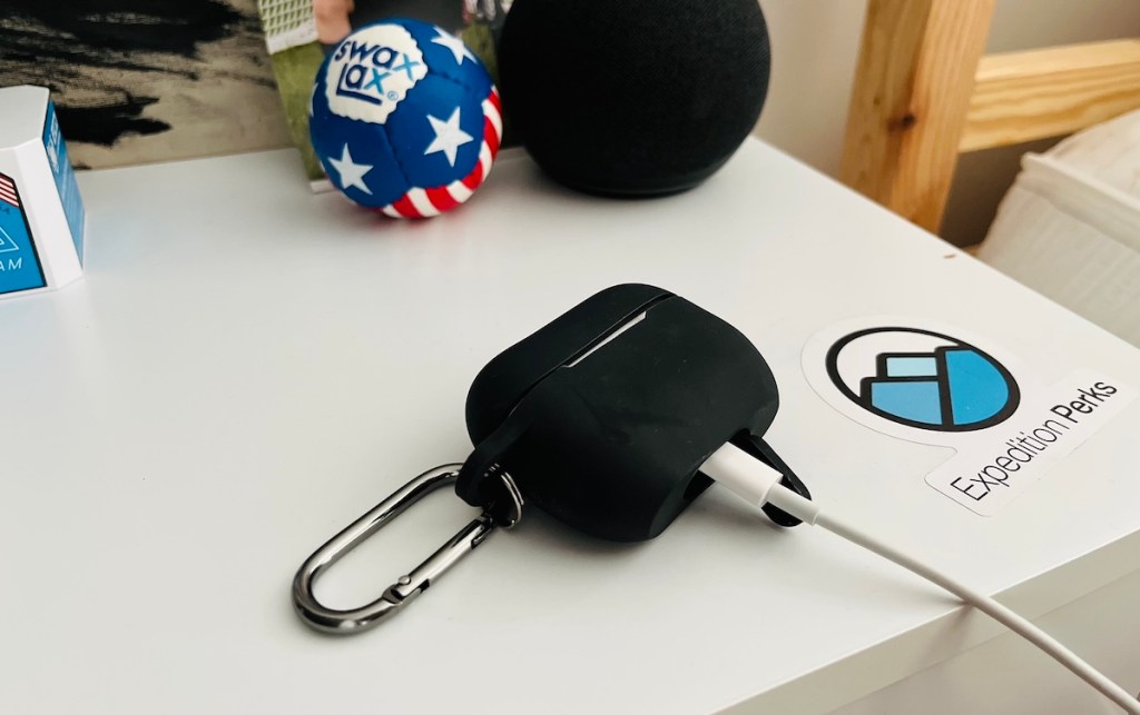 black silicone airpod case on nightstand