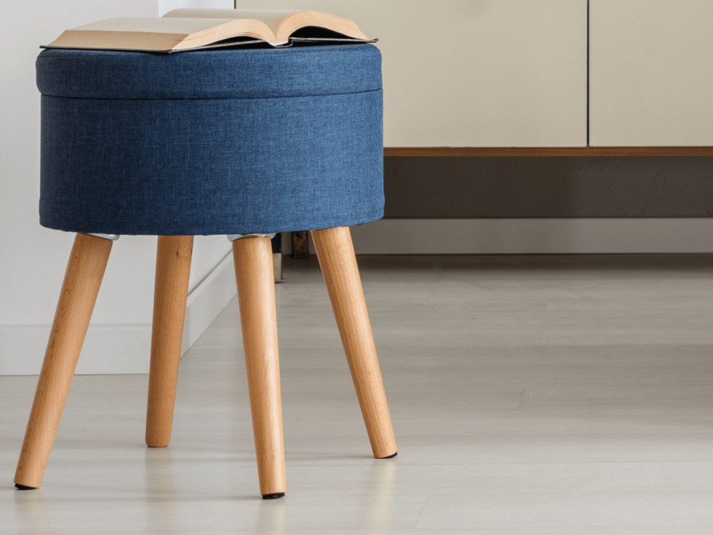 floor pads on stool with book on it