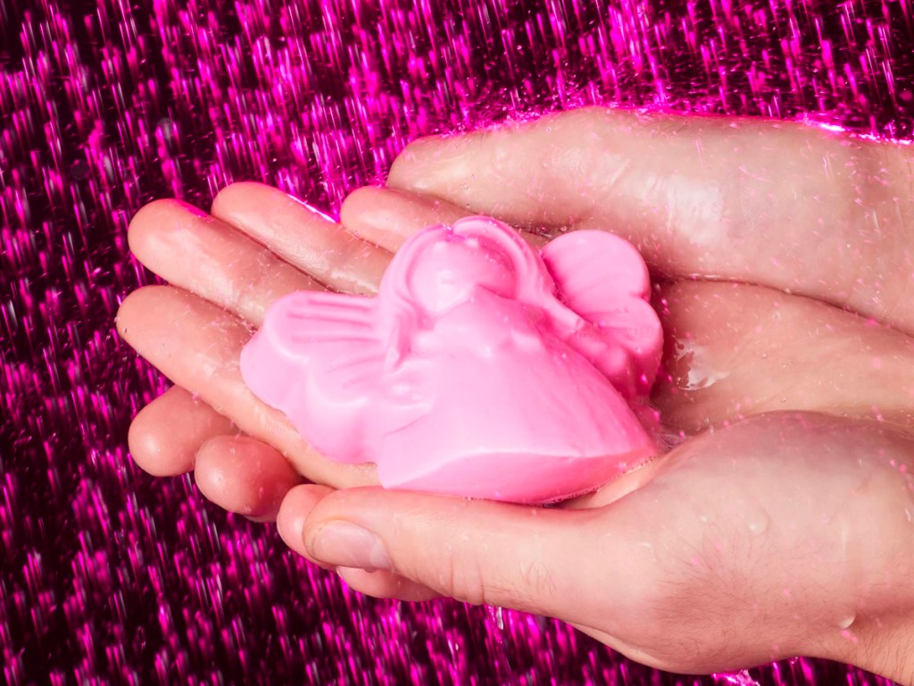 hand holding pink fairy soap