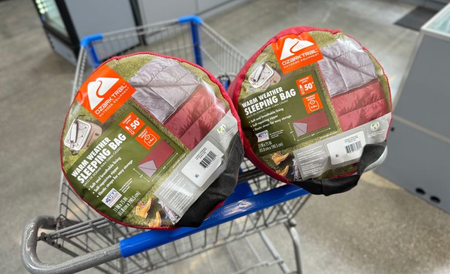 ozark trail warm weather sleeping bags in red, in a walmart cart