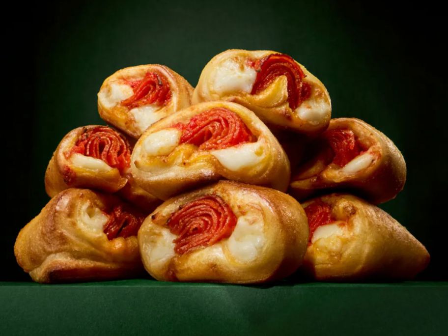 a pile of pepperoni stuffed pizza bites