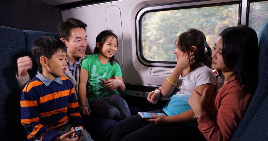 Family of 5 riding a train together