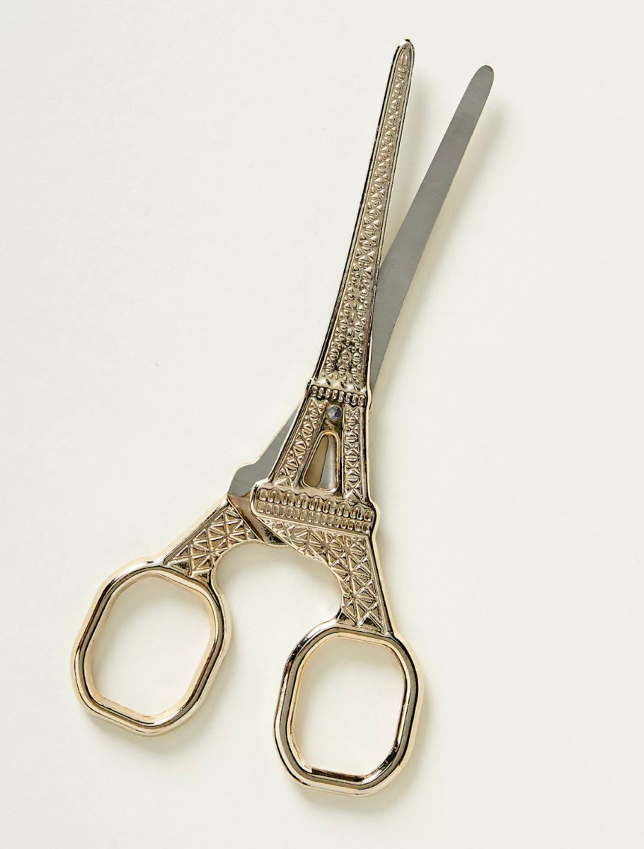 stock photo of eiffel tower scissors with white background