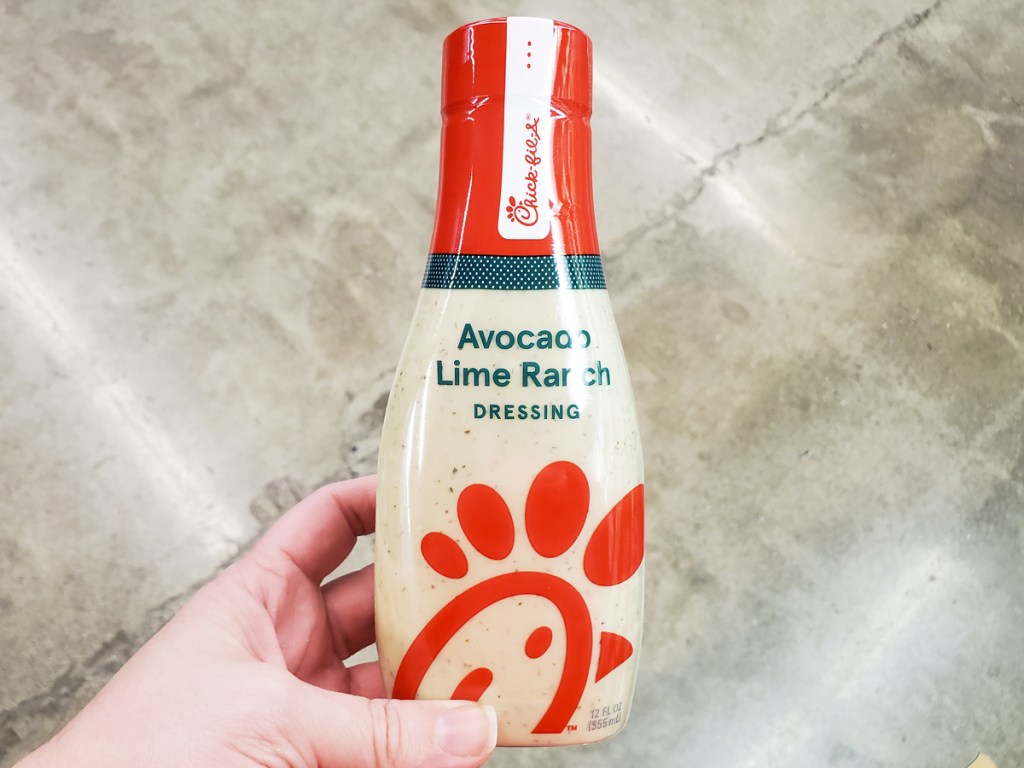 hand holding a bottle of Chick-Fil-A Salad Dressing