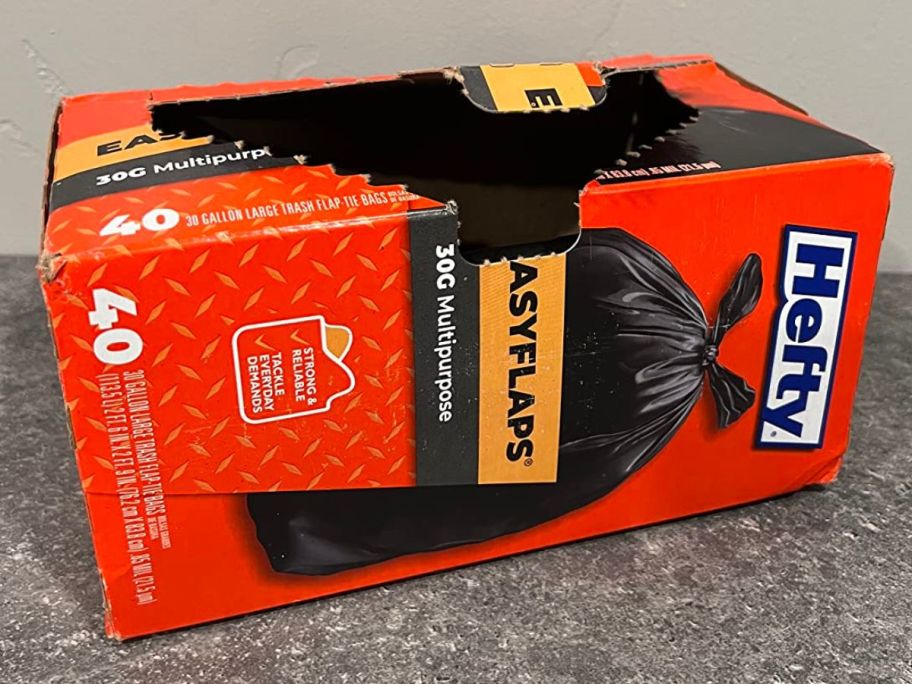 Box of opened Hefty trash bags on counter