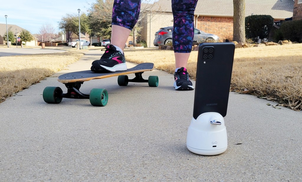 girl skateboarding in front of phone on tripod