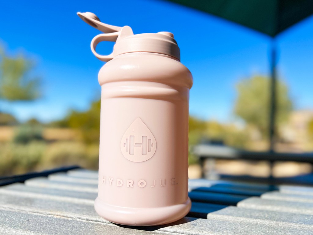 light pink hydrojug on table outside