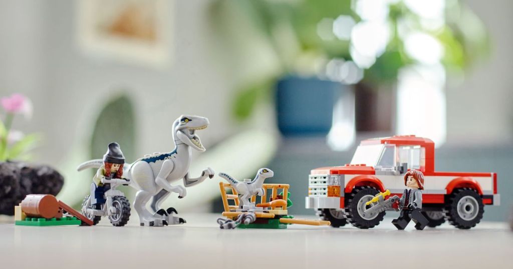 lego dinosaur and vehicle set