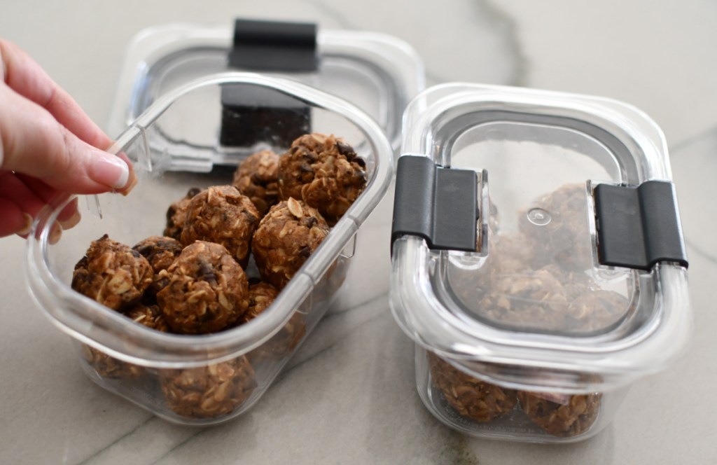 Two rubbermaid containers filled with no bake oatmeal energy bites