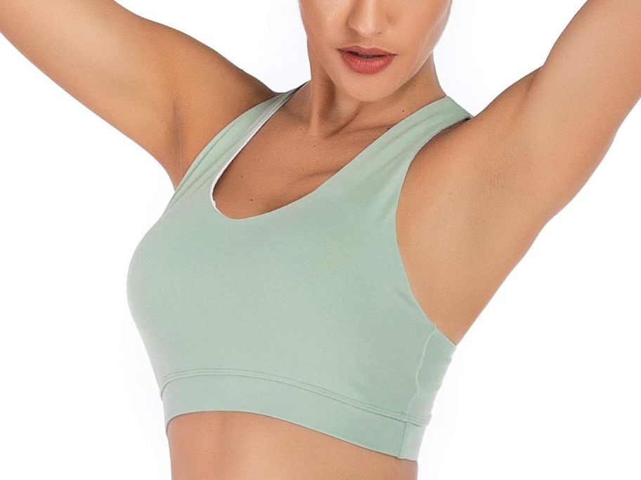 woman wearing white running girl sports bra with back showing