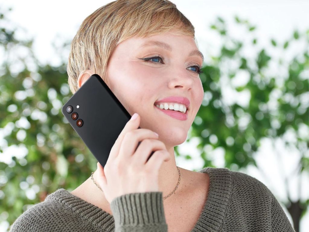 woman talking on black Samsung smartphone