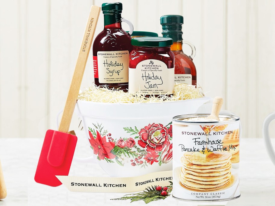 jam, syrup, pancake mix, spatula, and holiday batter bowl on counter