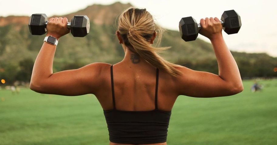 A woman lifting dumbbells