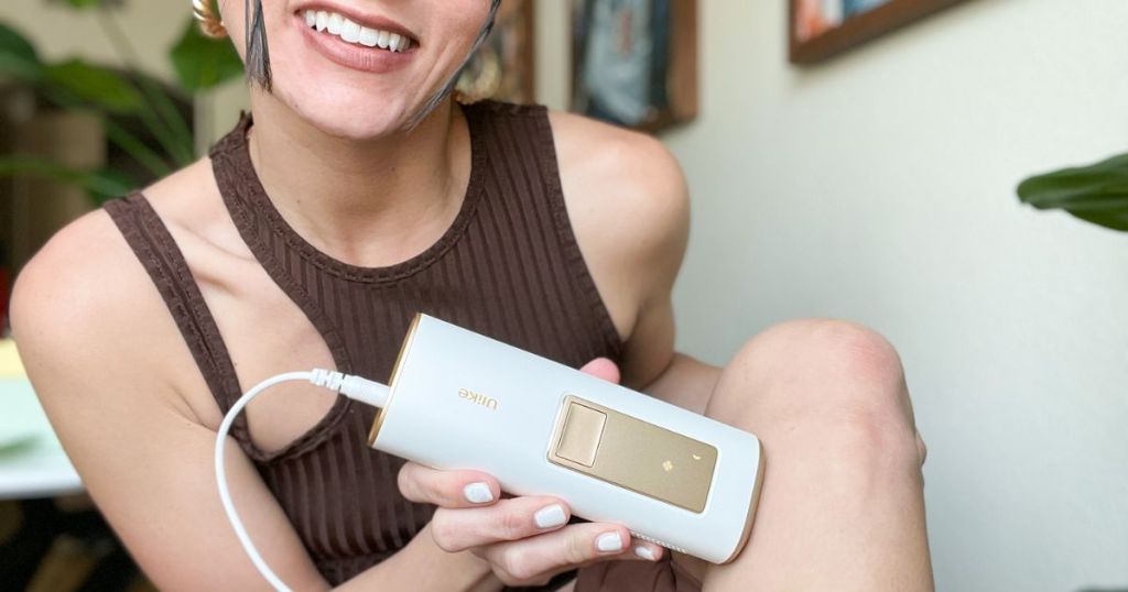 woman using Ulike Laser Hair Romoval on her leg