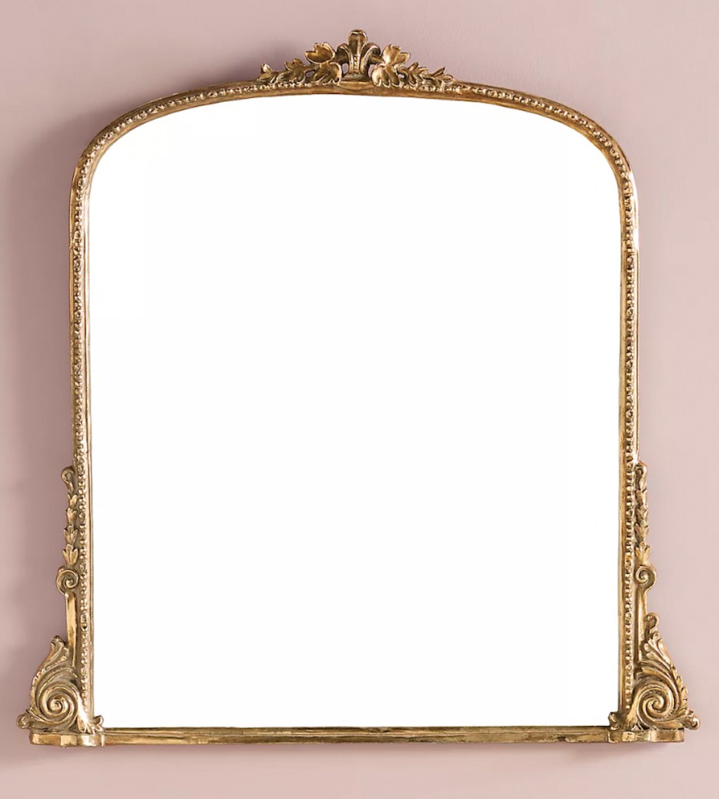 gold gleaming primrose mirror on pink wall 