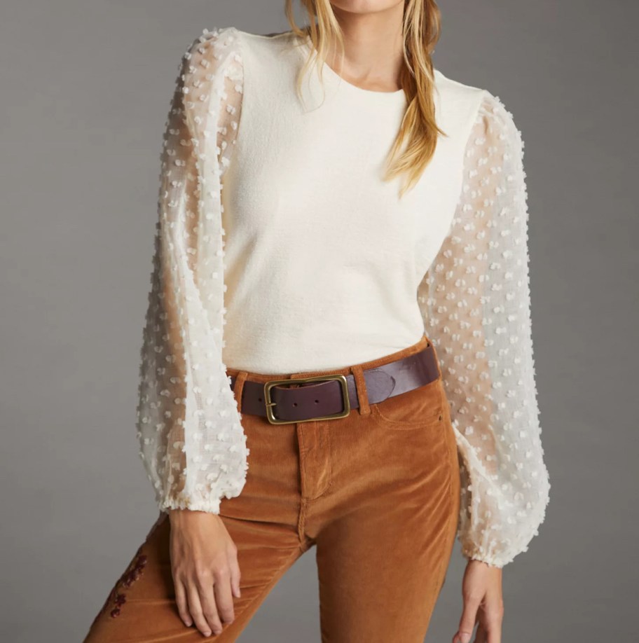 women wearing white textured sleeve shirt with orange pants