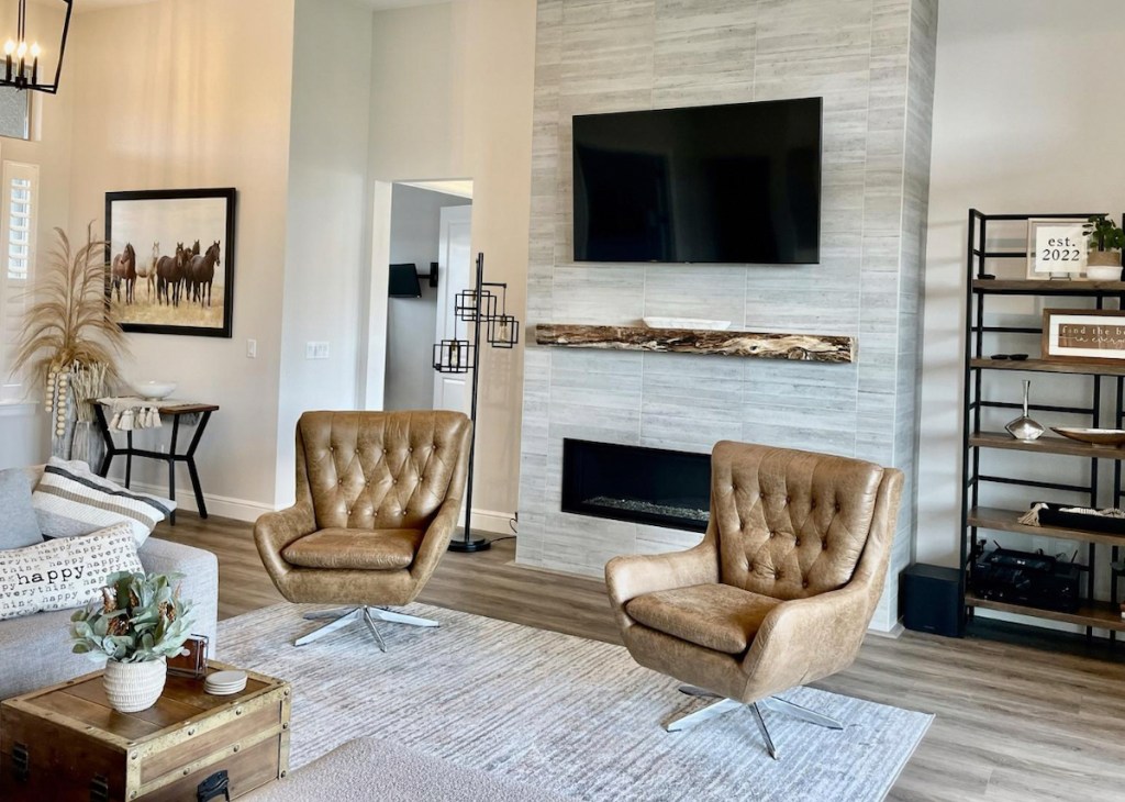 living room with tufted leather chairs