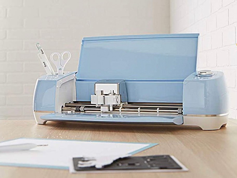 cricut explore air 2 in blue open on table 