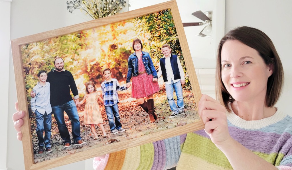 woman holding an epicpaint family portrait